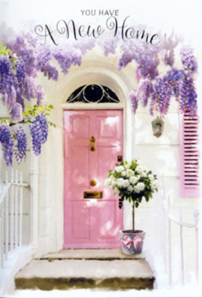 Arriving at this Erith doorstep, you can imagine the gentle rustle of wisteria overhead and the faint scent of roses mingling with the air that drifts in from the river. The front door is painted in a delicate blush pink, its muted tone lending a soft, inviting glow to the entrance. Crisp white walls on either side and a subtly coloured shutter frame the door, creating a simple canvas that lets the flowers truly shine. Above, wisteria cascades in lavish sweeps, each trailing stem heavy with small blossoms in shades of lavender, lilac, and dusky mauve. The clusters hang in loose curtains that seem to sway slightly, giving the sense of a serene, sheltered nook perhaps found along a side street not far from Erith Station. Their romantic drape softens the architecture, lending a cottage-garden feel to the façade. At the base of this pastel door, a florist's bucket in soft grey metal rests firmly on the step, brimming with roses in tones of white and cream. The blooms are full and generous, petals layered in spiral rosettes that feel rich and tactile even from a distance. Fresh green foliage is tucked among them, adding depth, contrast, and a hint of garden-fresh texture. A soft pink ribbon wraps around the bucket, tied with an understated flourish that echoes the door's colour and the wisteria's gentle purples. The light is calm and diffuse, casting faint shadows that ripple over the stone step and door panels, creating a peaceful, almost painterly atmosphere. The entire composition feels like a warm housewarming gesture from Flowers Erith - a carefully arranged welcome for someone settling into a new home, celebrating their fresh start with tenderness, grace, and a quietly joyful sense of belonging.
